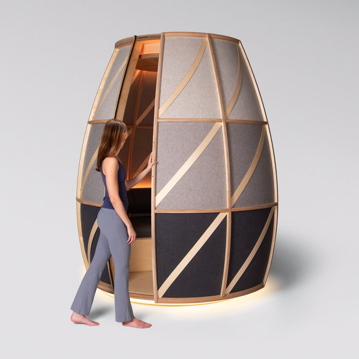 Woman stepping into the Iris pod